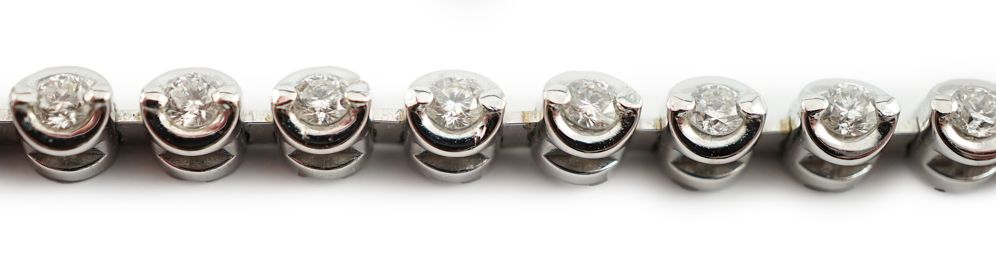 A modern 18ct white gold and diamond set line bracelet